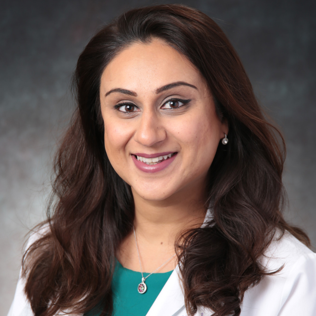 A friendly headshot of Redah Mahmood, MD