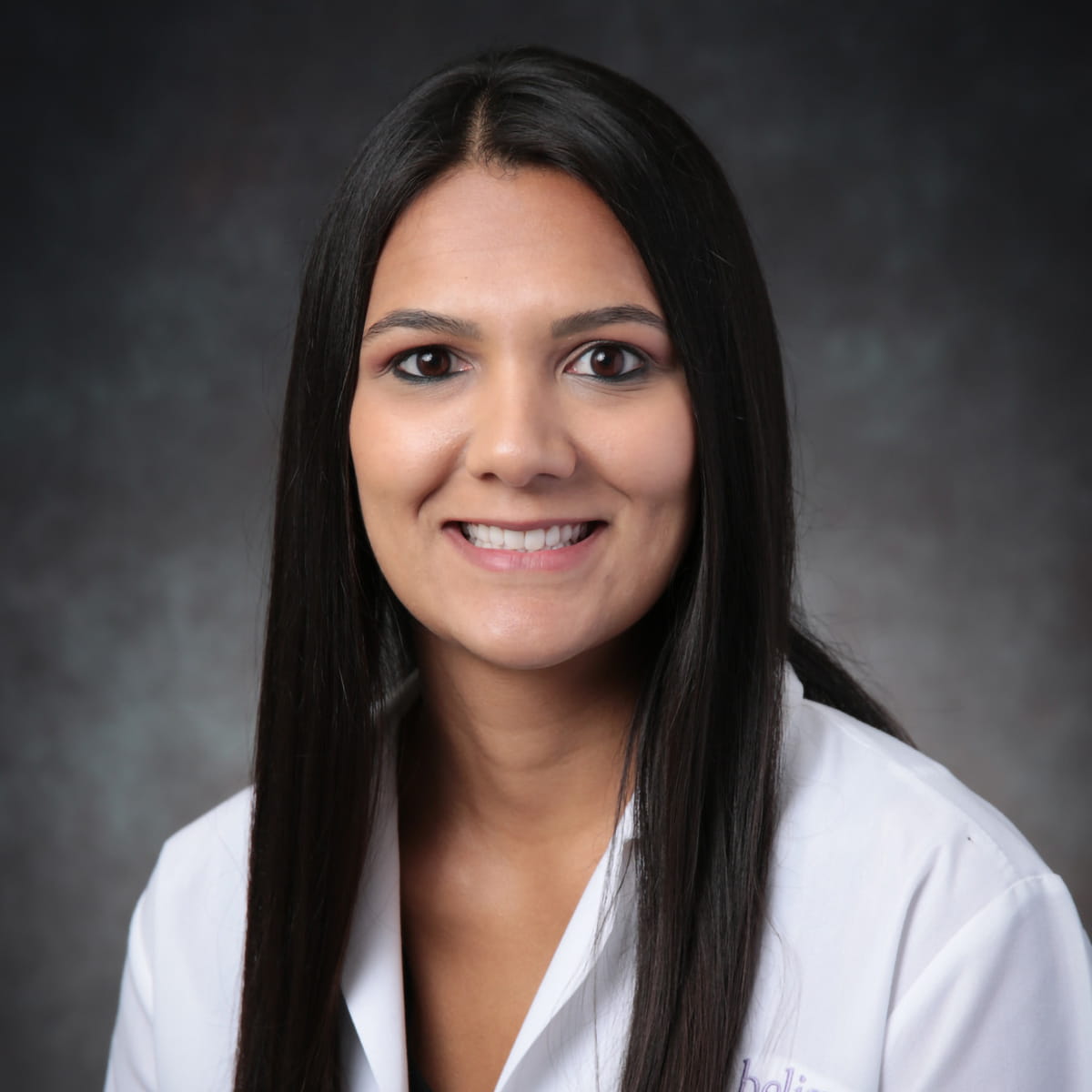 A friendly headshot of Reena Kabaria, MD