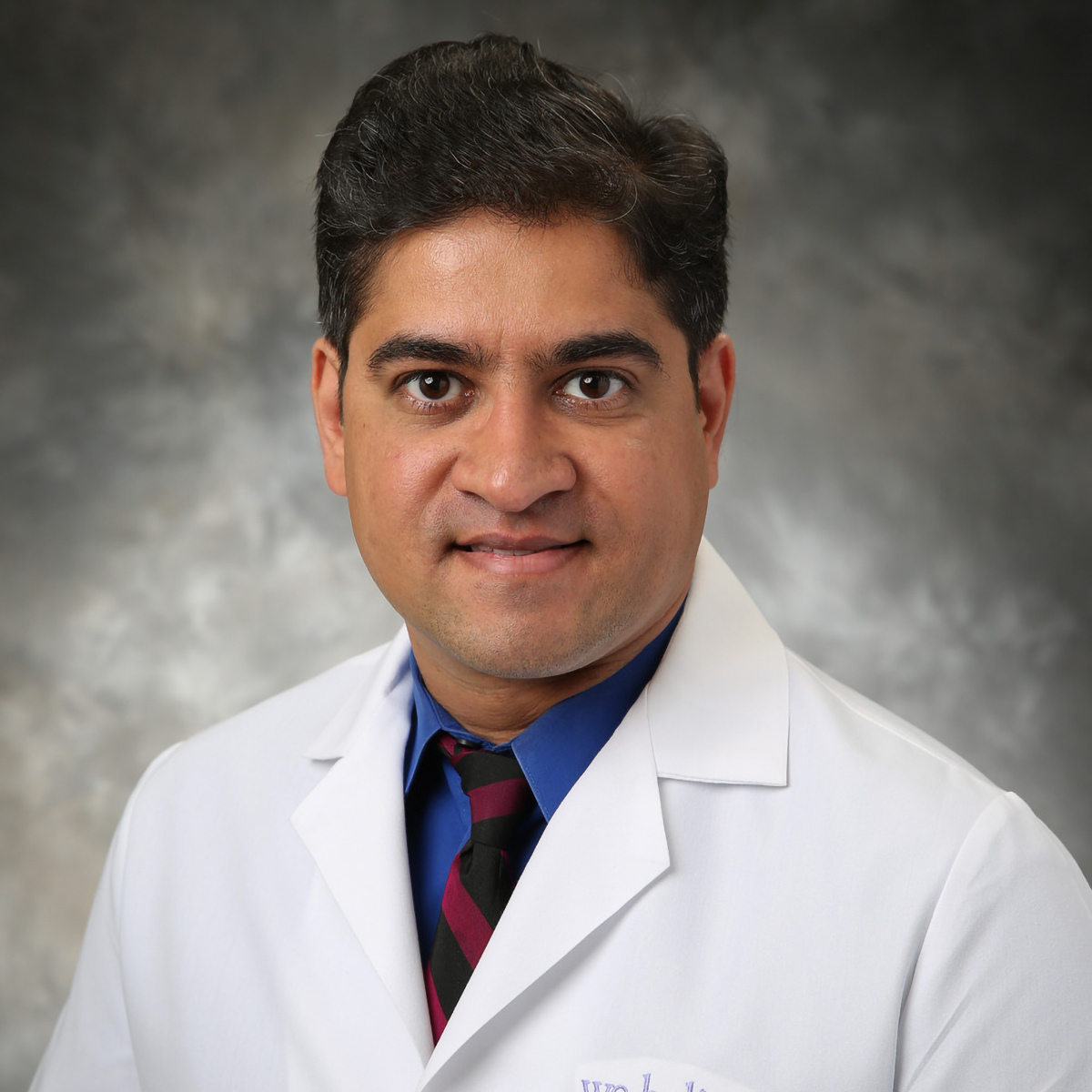 A friendly headshot of Rupesh Dave, MD