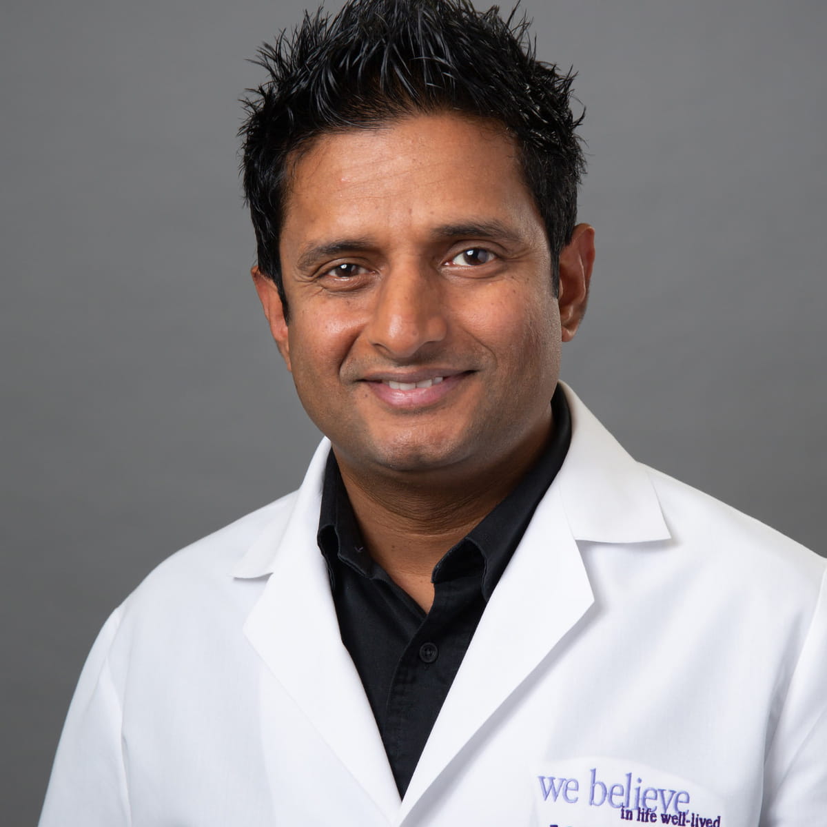 A friendly headshot of Sanath Allampati, MD