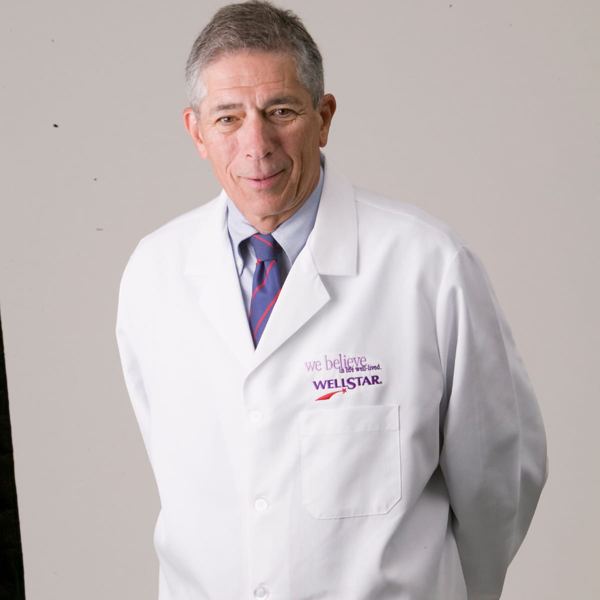 A friendly headshot of Seymour Rosenbloom, MD