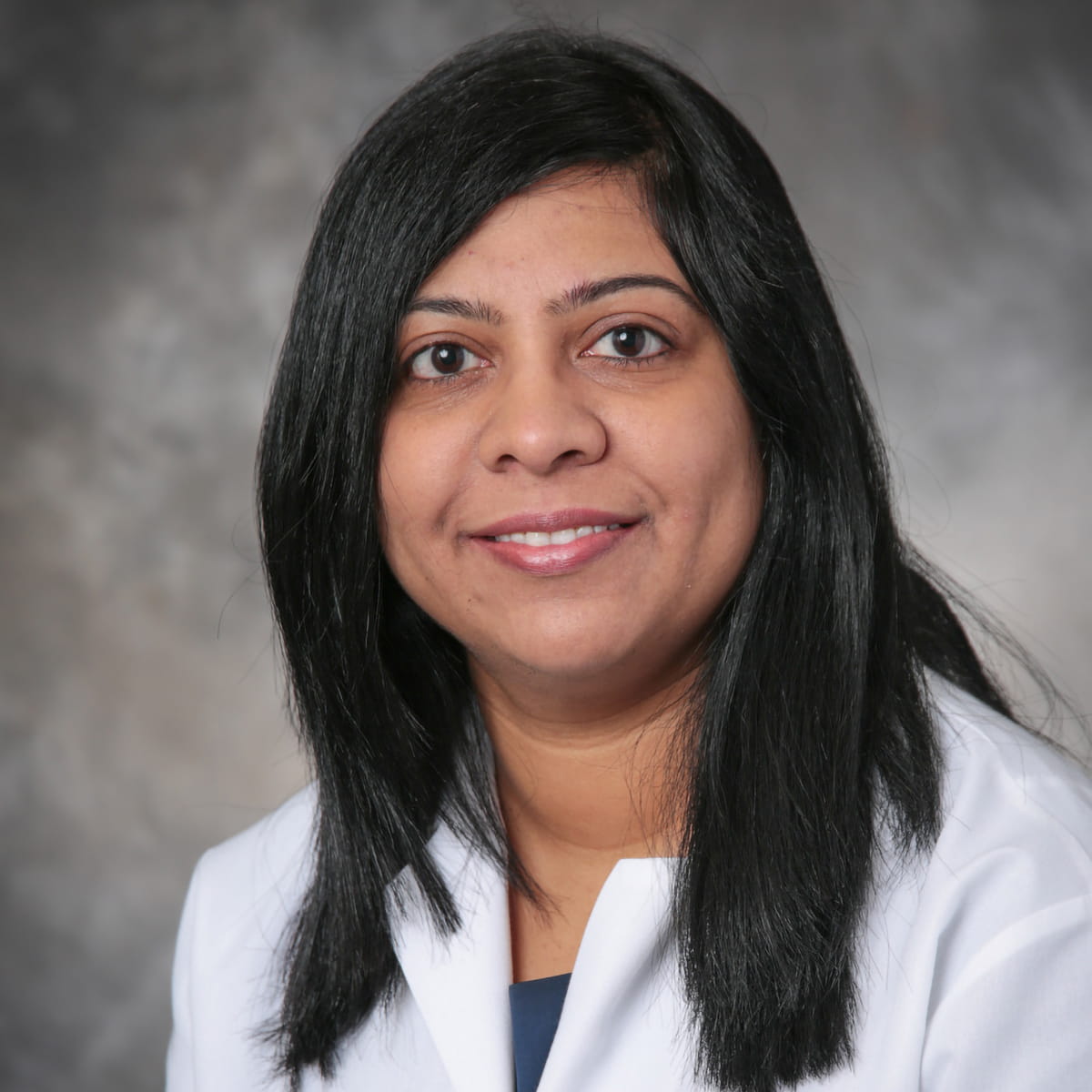 A friendly headshot of Sharada Anumula, MD