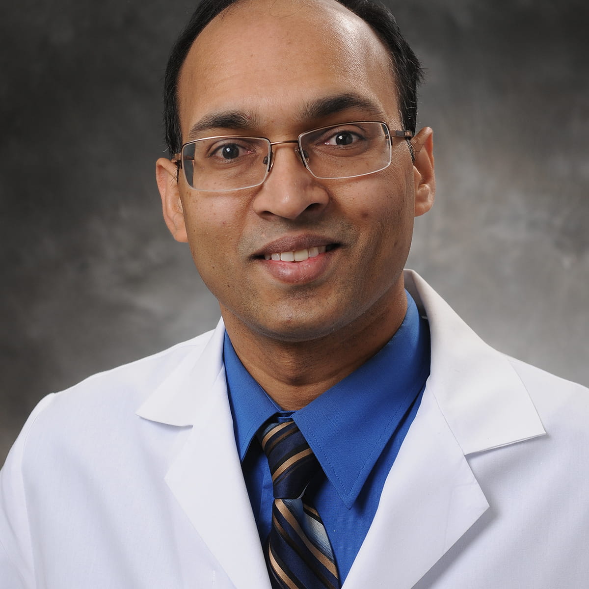 A friendly headshot of Sreedhar Maddineni, MD