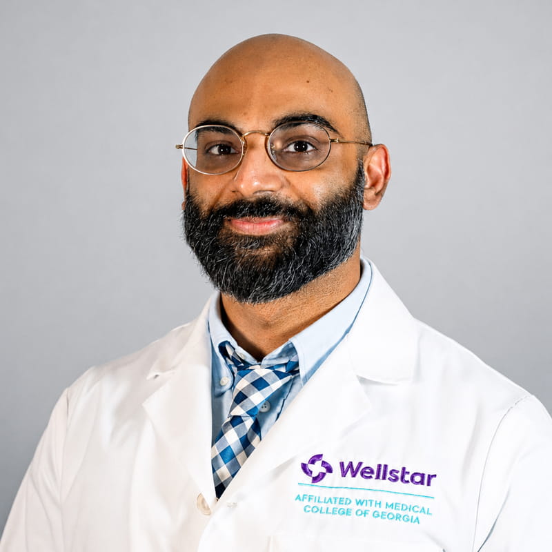 A friendly headshot of Sulman Mughal, MD