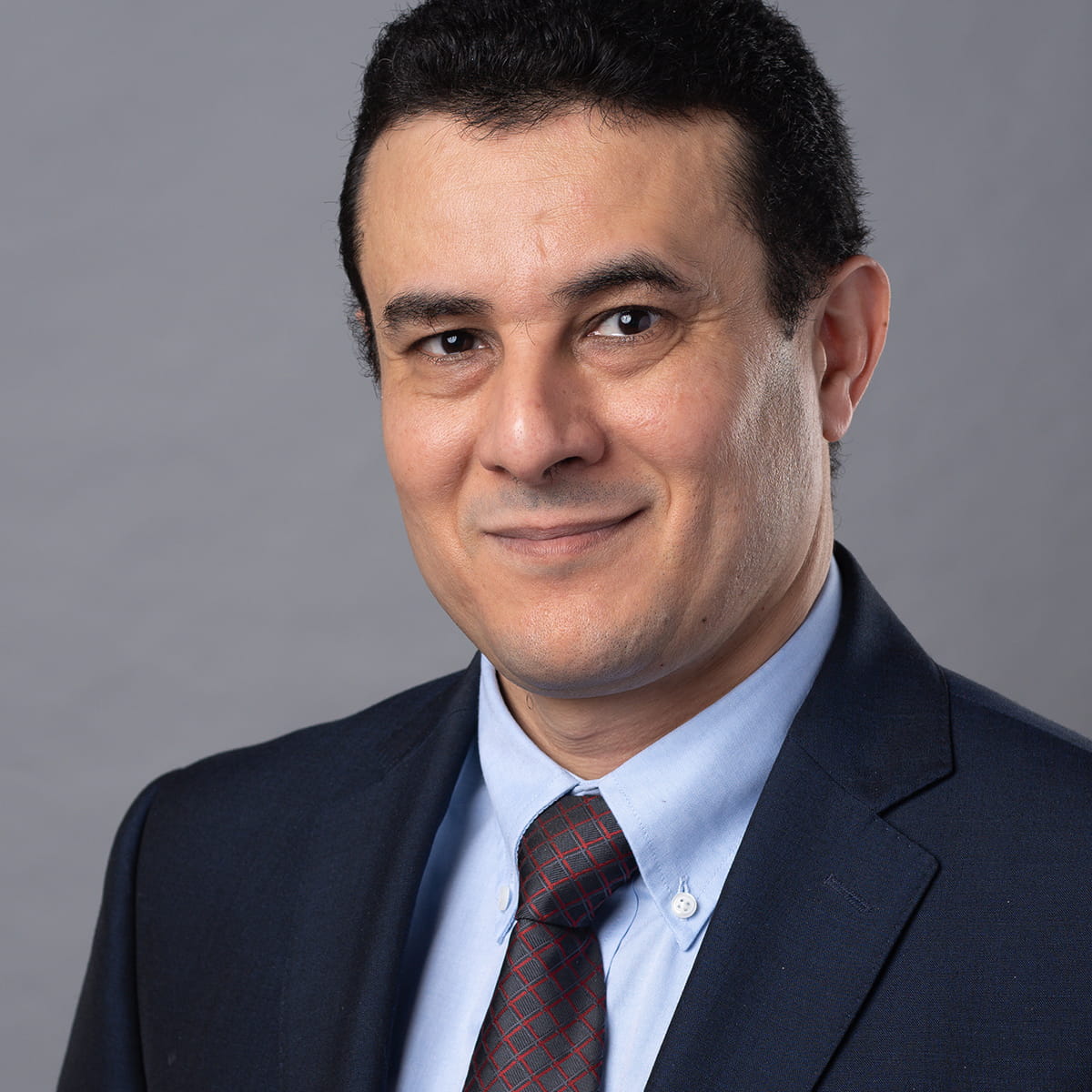 A friendly headshot of Talal Gharir, MD