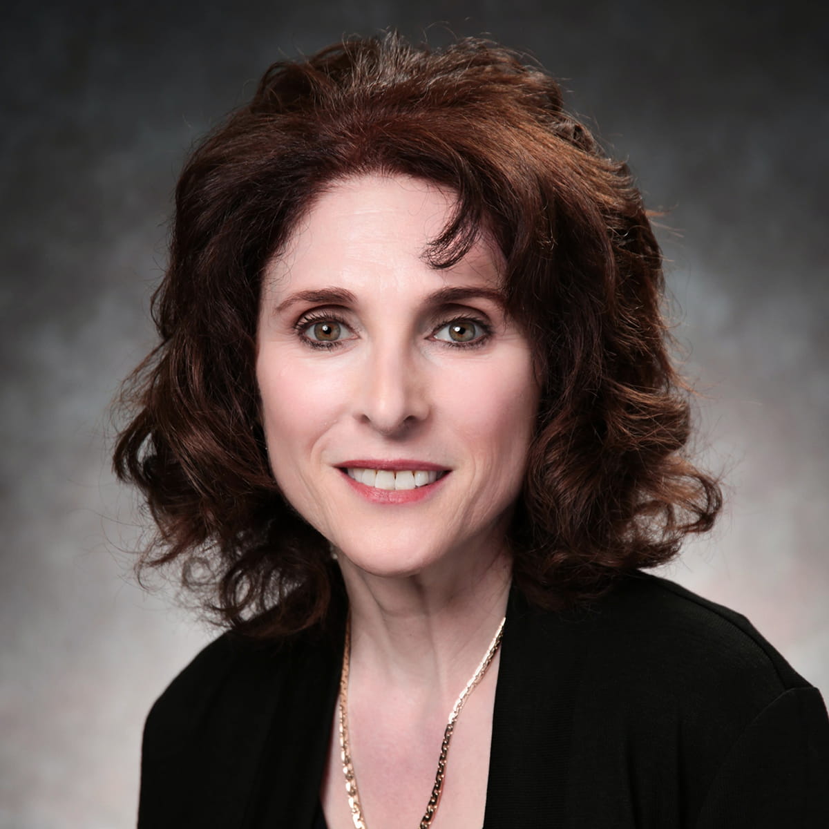 A friendly headshot of Tami Breton, MD