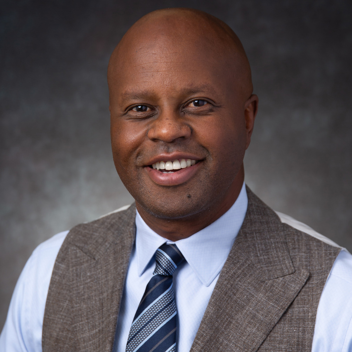 A friendly headshot of Tayari Mchezaji, MD