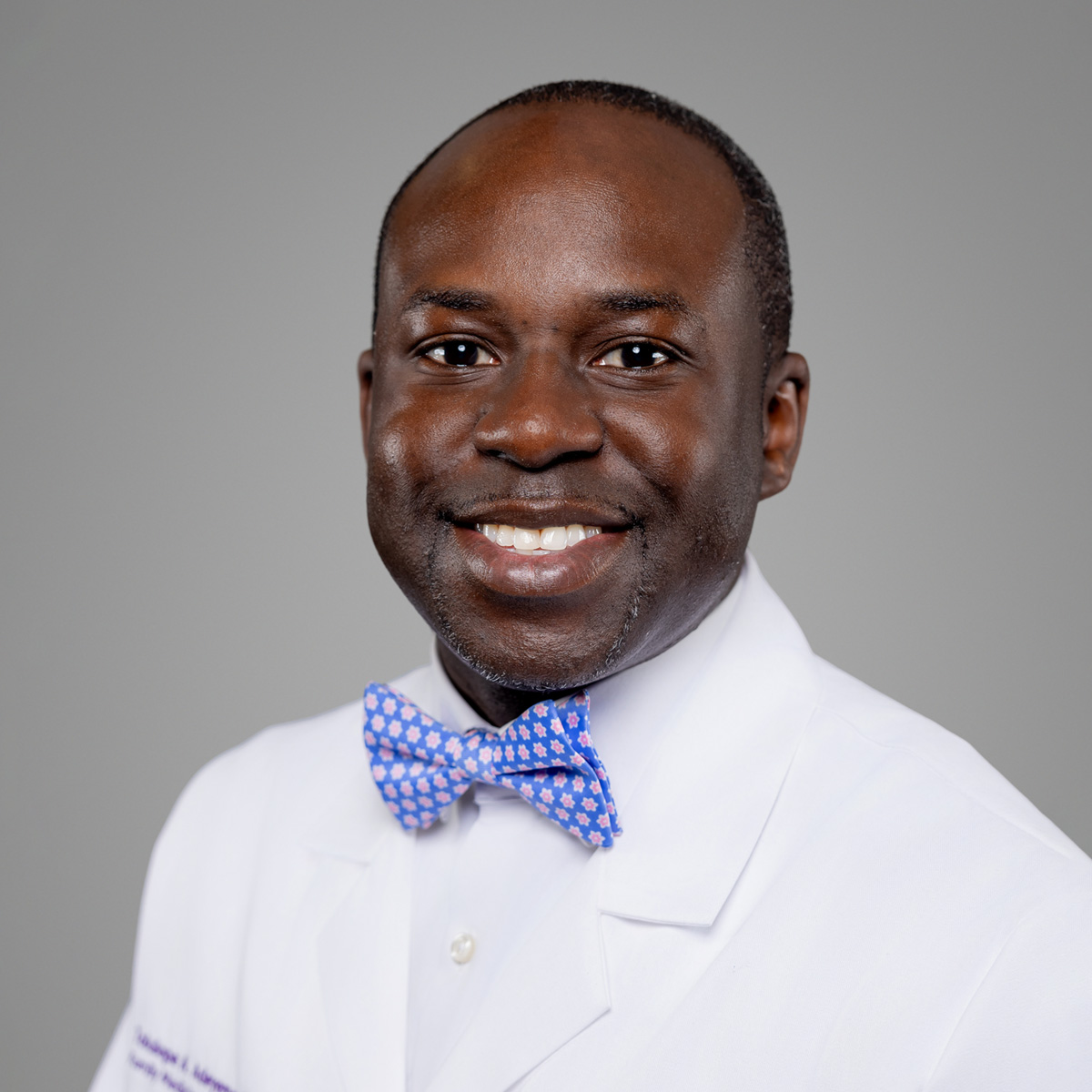 A friendly headshot of Tolulope Adeyemo, MD