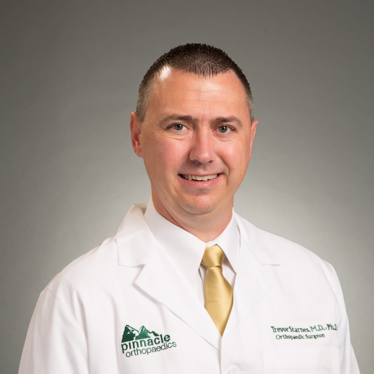 A friendly headshot of Trevor Starnes, MD