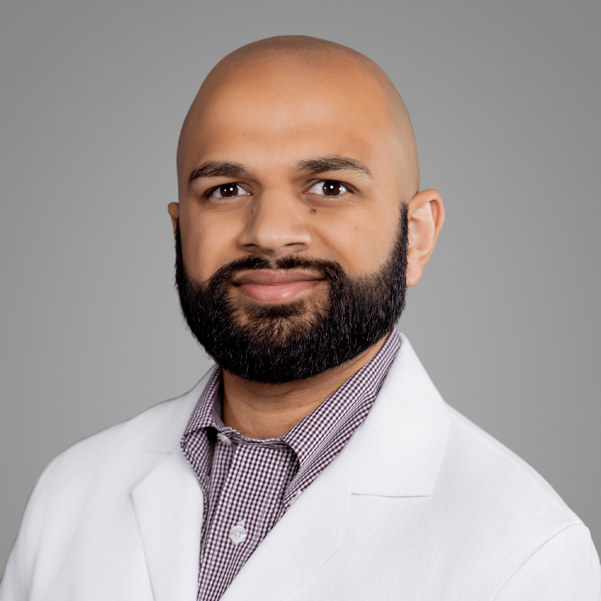 A friendly headshot of Tushar Ramesh, MD