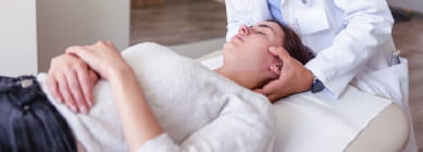 Chiropractor adjusting a patient