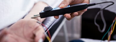 Nurse administering a neurophysiological treatment to a patient