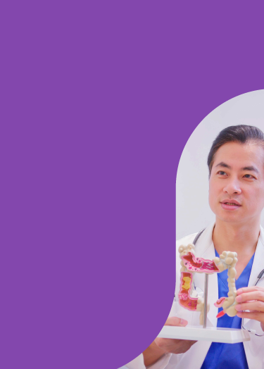 Image of doctor holding colon model