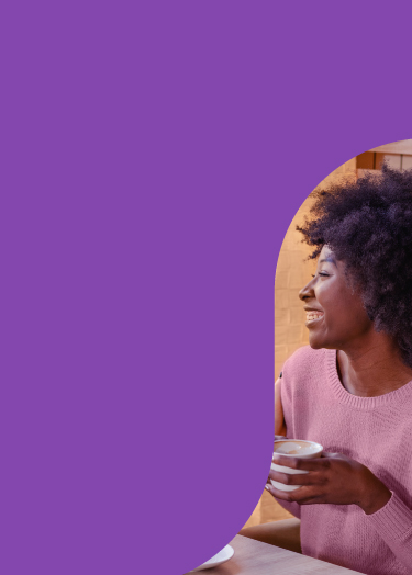 Image of women laughing over coffee