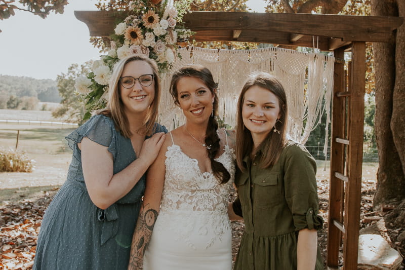 Ashley celebrates at her wedding with two Wellstar nurses.